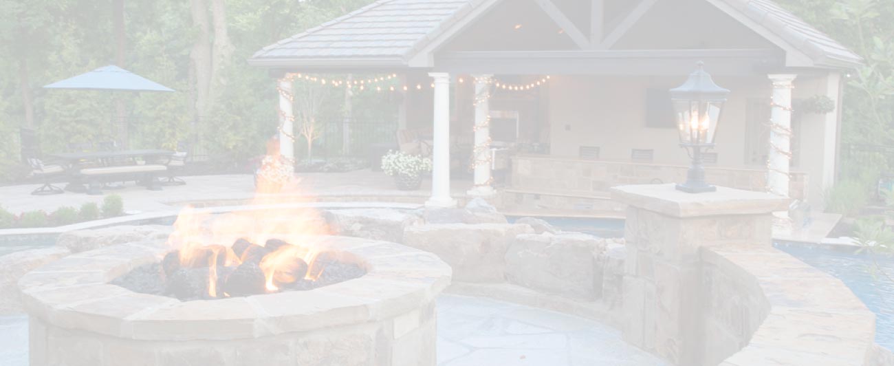 A-firepit-and-pool-house-by-Backyard-by-Design-Kansas-City