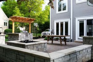 A beautiful patio with grill and firepit