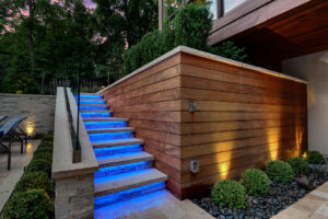 Backyard by design patio stairs and lighting